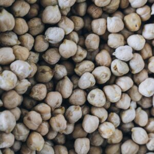 Detailed texture view of organic chickpeas, highlighting natural abundance and nutrition.